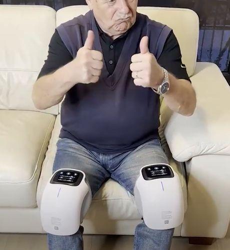 VibraHeat knee massager worn on knee for pain relief